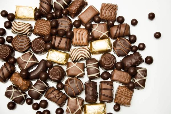 Chocolates background.  Assortment of fine chocolates in white, dark, and milk chocolate. Praline Chocolate sweets