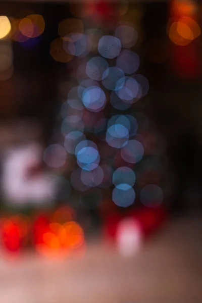 Defocus photo of christmas tree decorated with bright garland