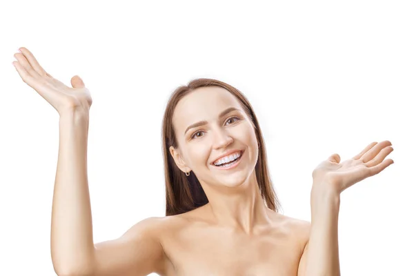 Happy smiling girl raised her hands with palms up isolated on white background — Stock Photo, Image