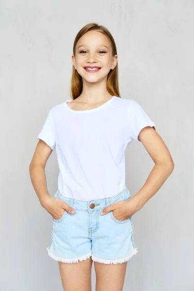 Young Sportive Girl White Shirt Hands Poskets Jeans Shorts Posing — Stock Photo, Image