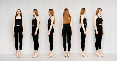 Dar siyah kotlu ve tişörtlü, elleri aşağıda ince bir kız.