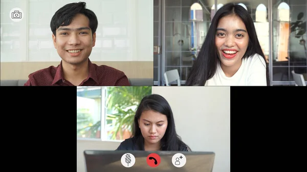 Video call screen shot the faces of Asian colleagues or partners meeting remotely with video conferences, greetings and meetings together while working from home and keep social distancing