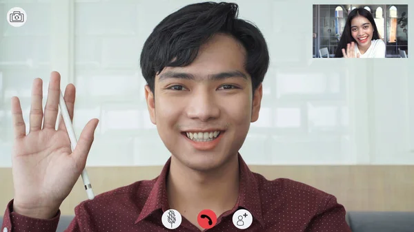 Video call screen shot the faces of Asian colleagues or partners meeting remotely with video conferences, greetings and meetings together while working from home and keep social distancing