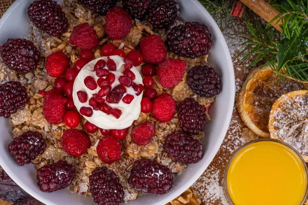 Festive Breakfast Cereal with Fruit and Yogurt.Festive dish of breakfast cereal with fresh berries, fruit and topped with natural Yogurt.