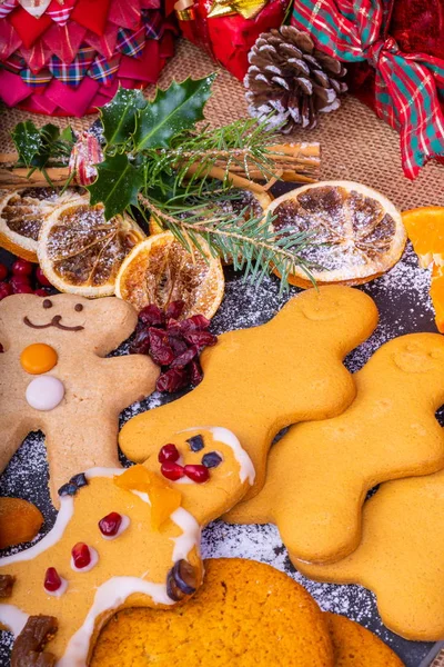 Festive Gingerbread Characters.Selection of festive decorated Christmas Gingerbread characters surrounded by presents and gifts.
