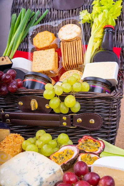 Cheese Crackers and Pickle Hamper.Wicker Hamper full of cheese, crackers with a selection of pickles and fruits.
