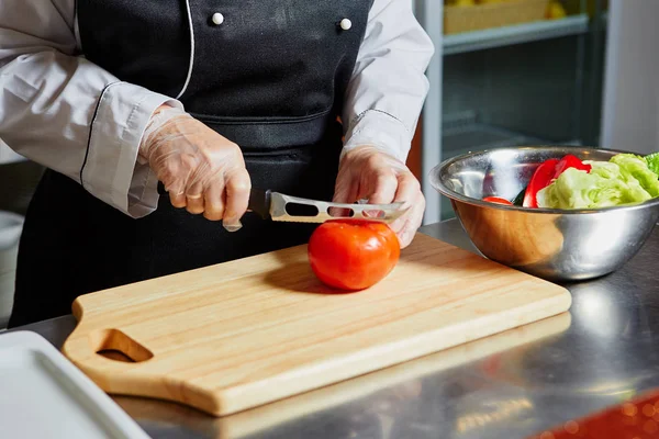Cutting Tomato on Chopping Board,Closeup