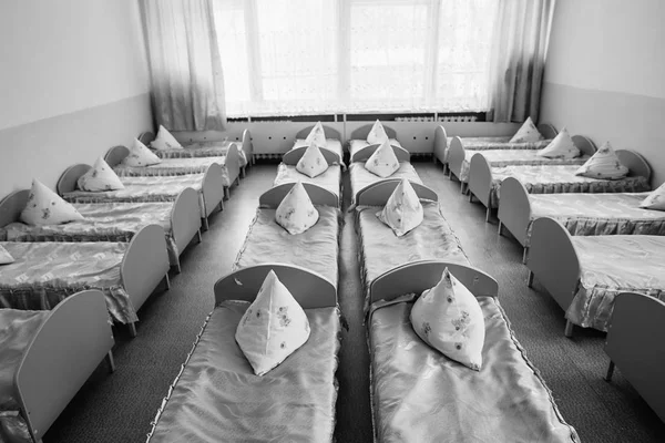 Cots in the kindergarten. Orphanage or boarding school. Beds in a boarding school or in an orphanage