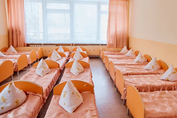 Cots in the kindergarten. Orphanage or boarding school. Beds in a boarding school or in an orphanage