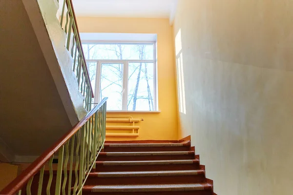 Close-up of the internal staircase in the old school. Empty stairs.