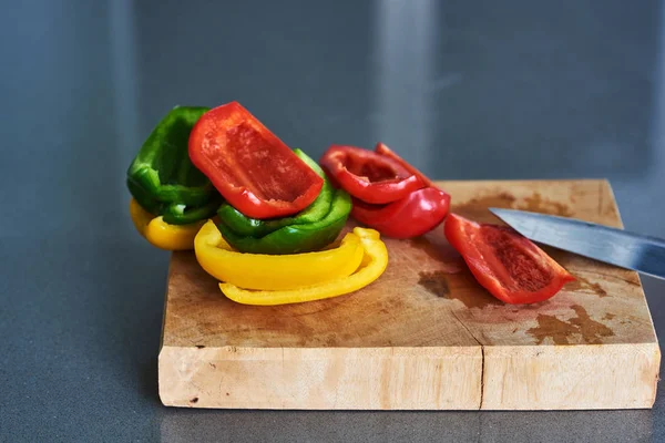Cooking Red yellow, green Bell Pepper. Cutting.
