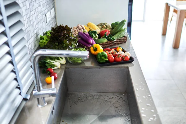 Fresh vegetables washing. Healthy food. Kitchen.