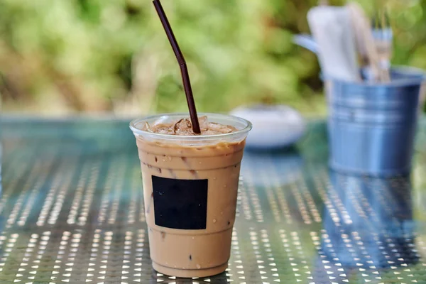 Iced coffee or caffe latte in takeaway cup.