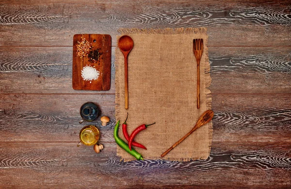 The trendy restaurant is interesting to lay the table before serving the main hot meal on the table for each guest personally put linen towel next to a large wooden instruments