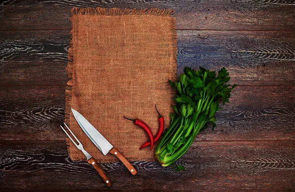 Ideas for the restaurant, dishes in a rustic style on linen with vintage silver knife and fork, betrays a great bunch of greens fresh flavor to any dish