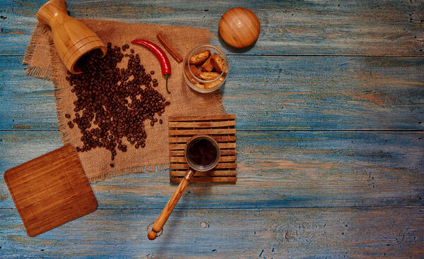 In the old sun-bleached wooden table with coffee pots worth and fresh pastry