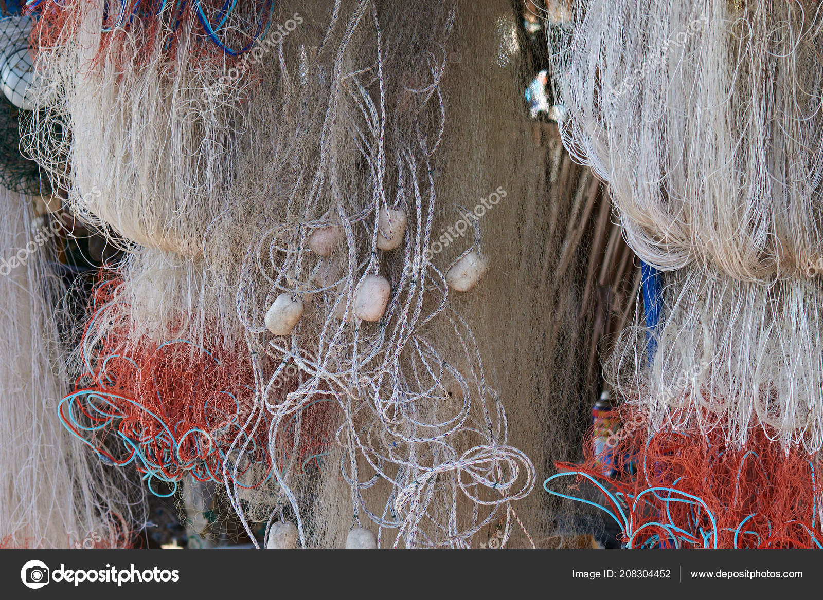 https://st4.depositphotos.com/5604060/20830/i/1600/depositphotos_208304452-stock-photo-fishing-nets-hang-outdoor-drying.jpg