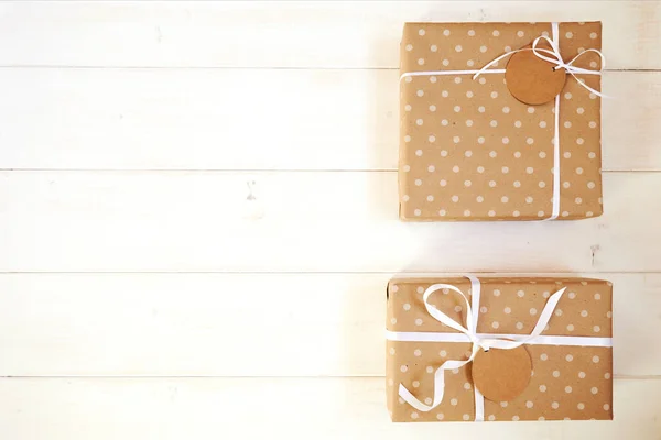 Two Gift Boxes Wrapped Kraft Paper White Ribbon Tag Text — Stock Photo, Image