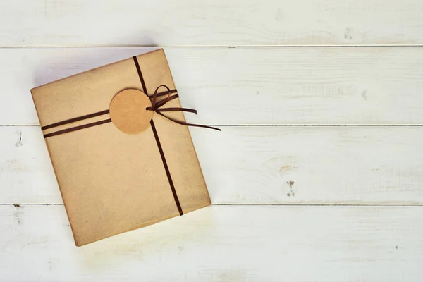 Gift Box Wrapped Kraft Paper Brown Ribbon Tag Text Christmas — Stock Photo, Image