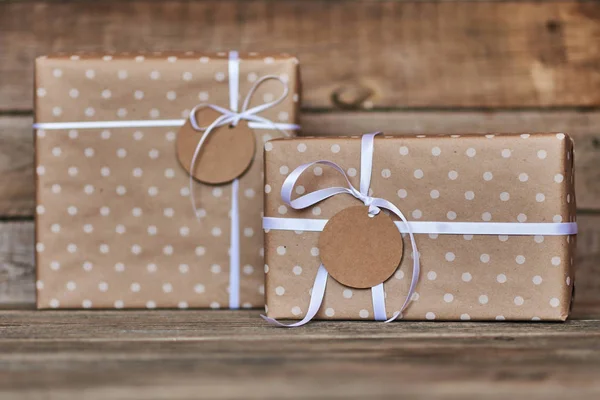 Two Gift Boxes Wrapped Kraft Paper White Ribbon Tag Text — Stock Photo, Image