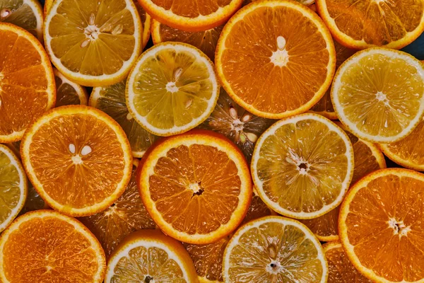 Stack of citrus fruit slices. Slices of lemon, orange, lime. Fruit food background. Healthy eating and diet. Top view.
