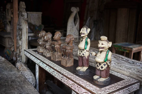 Different wooden Balinese souvenirs displayed in art and craft tourist market. Indonesian handicrafts. Souvenir from Bali. Traditional product of handicraft. Typical souvenirs at the famous market