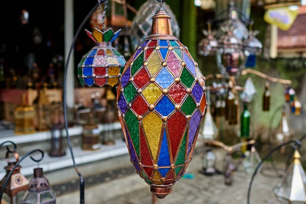 Vintage style lamps. Entrance to a store decorated with traditional lamps in various forms and colors. Amazing traditional handmade  lamps in souvenir shop. Mosaic lamps and lanterns background