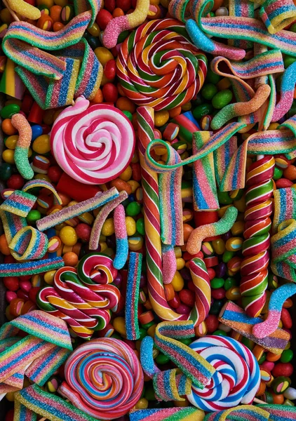 Colorful Bright Assorted Candy Canes Rainbow Colored Spiral Lollipops Scattered — Stock Photo, Image