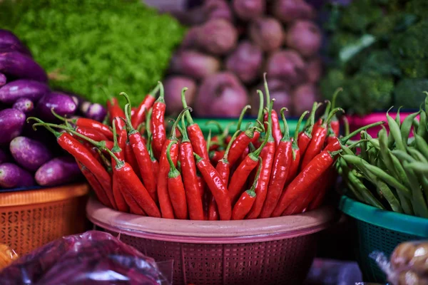 Colorful fruits and vegetables in the marketplace. Bright summer background. Healthy vegetables, food, raw ingredient. Natural nutrition for diet. Organic vegetables. Summer crops. Selective focus.