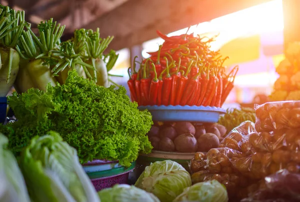 Colorful fruits and vegetables in the marketplace. Bright summer background. Healthy vegetables, food, raw ingredient. Natural nutrition for diet. Organic vegetables. Summer crops. Selective focus.