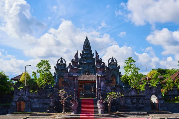 Beautiful view of ancient stone carving of temple on Bali island. Balinese hindu temple ornamented by carvings and sculptures. Old hindu architecture, ancient design. Summer and vacation concept.