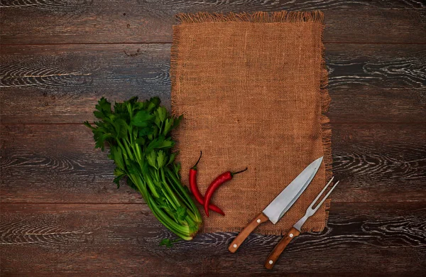 Ideas for the restaurant, dishes in a rustic style on linen with vintage silver knife and fork, betrays a great bunch of greens fresh flavor to any dish