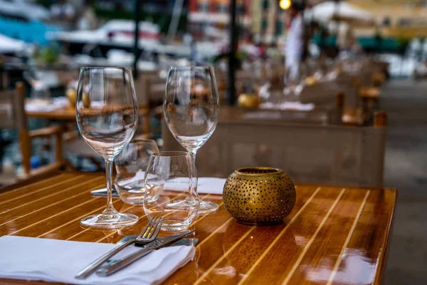 Close up of outdoor restaurant table in the evening. Restaurant chilling out classy lifestyle reserved concept. Restaurant interior. Table set restaurant.