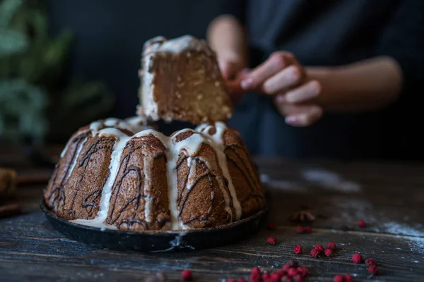 Christmas baking. Cooking homemade cake at home rustic kitchen. Woman\'s hands. Ingredients for cooking christmas baking on dark wooden table. Holidays, winter, Christmas concept. Soft focus.