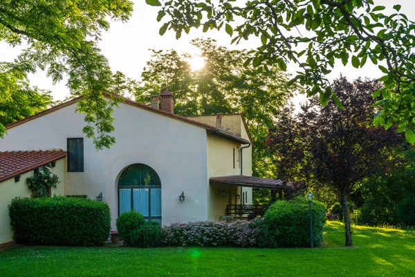 Traditional italian villa with yard and garden, Tuscany, Italy.