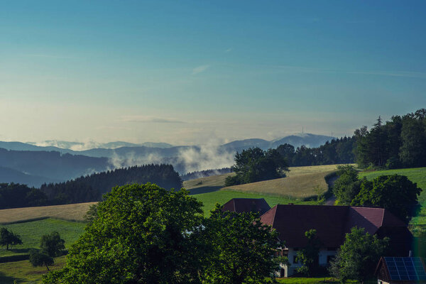 Scenic view of a picturesque mountain village in Germany, Black Forest. Summer vacation and ecology background. Sustainable ecosystem and healthy environment concept.