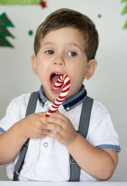 Happy Little Kid Holding Christmas Candy Cane New Year Mood Stock Photo