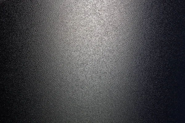 Ground glass surface in black tone. Abstract background and texture for design.