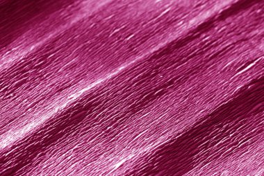 Krep kağıt ile bulanıklık etkisi pembe renkte. Arka plan ve doku.