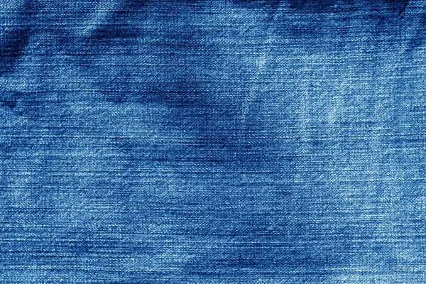 Jeans cloth pattern in navy blue color. Abstract background and texture for design.