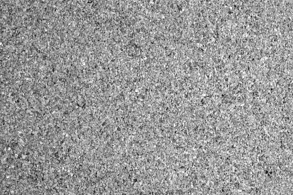 Cork board surface in black and white. Abstract background and texture for design.