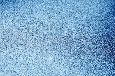 Işıltılı arka plan bulanıklık etkisi ile lacivert renkte. Arka plan ve tasarım için doku.