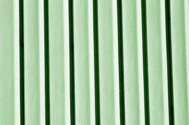 Duvar doku yeşil tonda dış cephe kaplaması plastik. Arka plan ve tasarım için doku.
