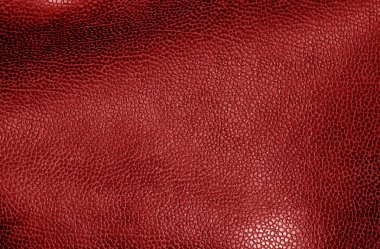Deri yüzeyi kırmızı tonda. Arka plan ve tasarım için doku.