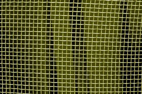 Metal kafes ızgara desen sarı tonda. Arka plan ve doku.