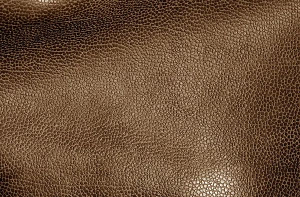 Leather surface in brown color. Abstract background and texture for design.