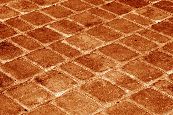 石畳のオレンジ色のトーンで通り 抽象的な背景とデザインのためのテクスチャ — ストック写真