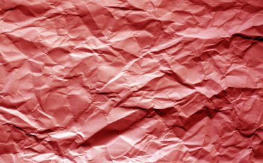 Buruşuk sayfaya bulanıklık etkisi kırmızı tonda. Arka plan ve tasarım için doku.