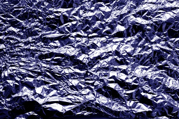 Metal foil texture in blue tone. Abstract background and texture for design.