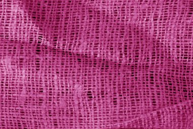 Buruşuk Tekstil yüzeyi pembe renkte. Arka plan ve tasarım için doku.